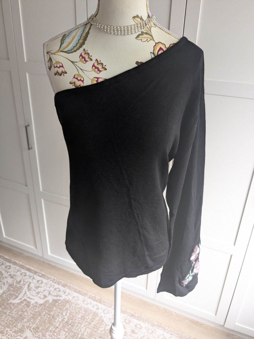 cleo Black One-Shoulder Sweatshirt with Floral Embroidered Cuff